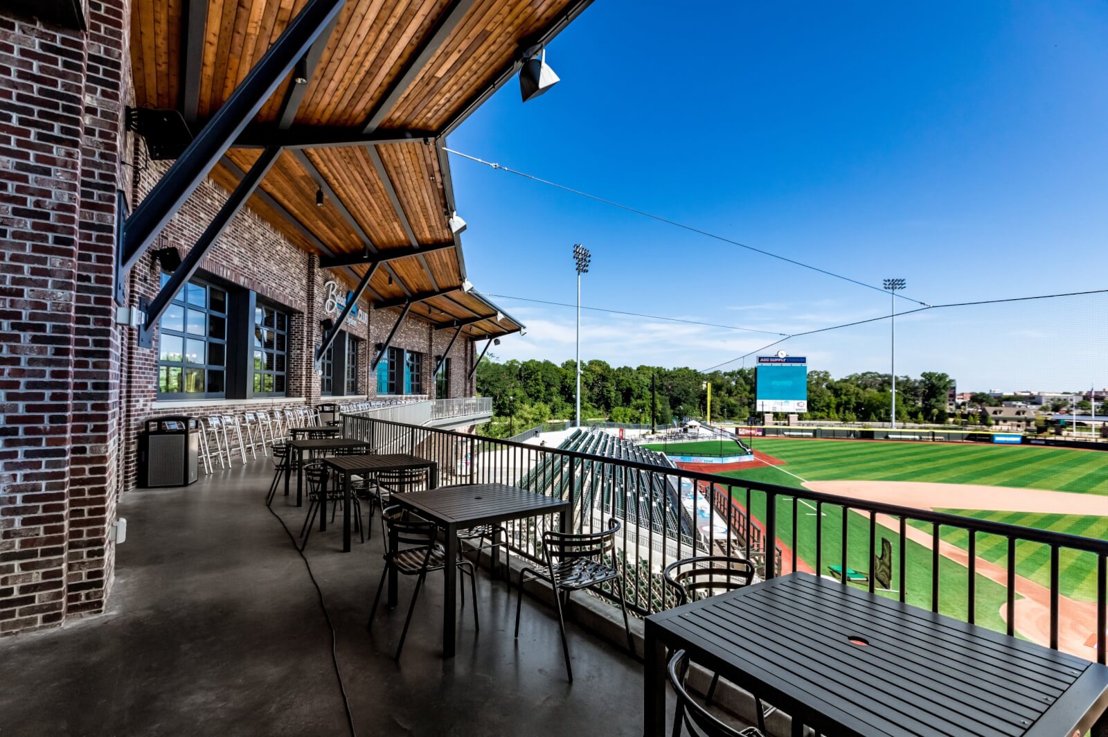 Meetings and Sports Empty tables along the breezeway at a baseball stadium.